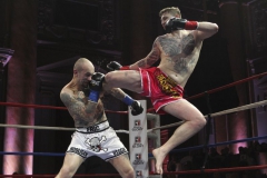 Eric Utsch (left) blocks a flying kick to his face delivered by Brett Hlavacek (right) during their Semi-Final bout in the Road To Glory at the Capitale Ballroom in New York, NY on Friday, March 22, 2013.  © Edward Diller